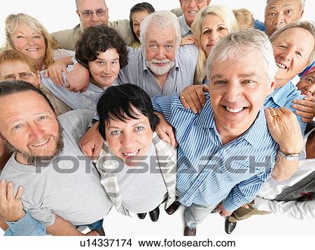 A group of people standing with their arms around each other View Large Photo Image Picture - A group of people standing with their arms around each other. Fotosearch