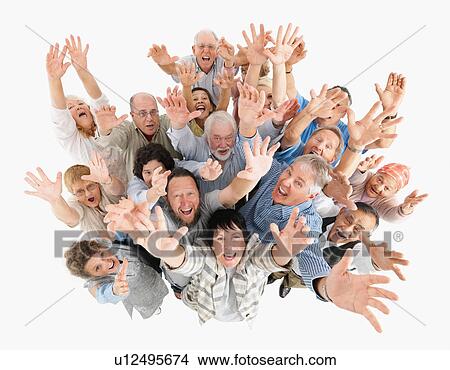 A group of people waving with their arms raised View Large Photo Image Picture - A group of people waving with their arms raised. Fotosearch