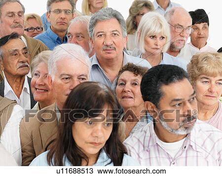 A group of serious looking people View Large Photo Image Stock Image - A group of serious looking people. Fotosearch