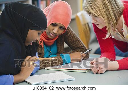 Stock Image - Adults students learning English as a second language. Fotosearch