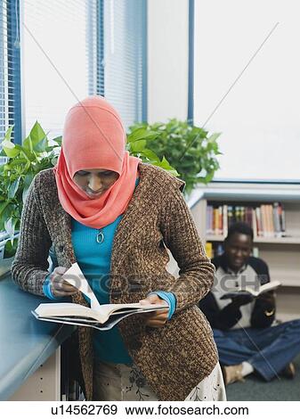 Stock Photo - Adults students learning English as a second language. Fotosearch