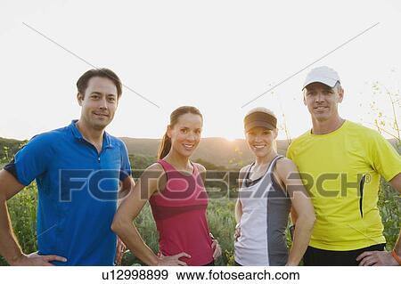 Athletes posing for the camera View Large Photo Image Stock Photo - Athletes posing for the camera. Fotosearch