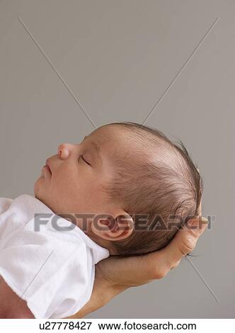 Baby sleeping in mother's hands View Large Photo Image Stock Photo - Baby sleeping in mother's hands. Fotosearch
