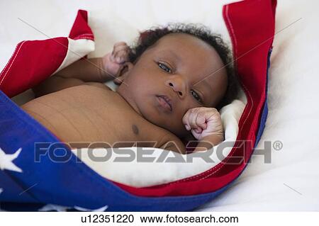 Baby wrapped in American flag View Large Photo Image Stock Image - Baby wrapped in American flag. Fotosearch