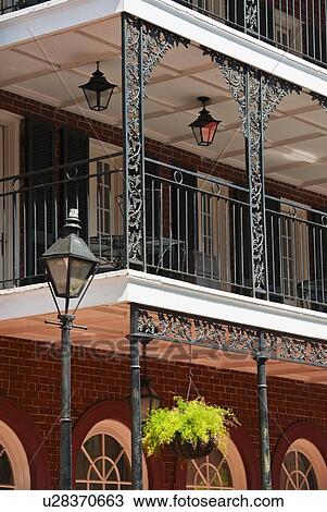 Stock Image - Balconies on building in the French Quarter of New Orleans. Fotosearch