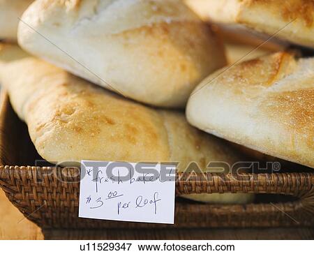 Stock Photo - Basket of freshly baked bread in bakery. Fotosearch