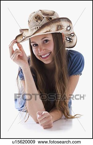 Beautiful cowgirl tipping her hat View Large Photo Image Stock Photo - Beautiful cowgirl tipping her hat. Fotosearch