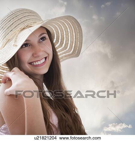 Beautiful long haired woman daydreaming View Large Photo Image Picture - Beautiful long haired woman daydreaming. Fotosearch