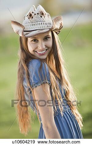 Beautiful smiling cowgirl View Large Photo Image Stock Photo - Beautiful smiling cowgirl. Fotosearch