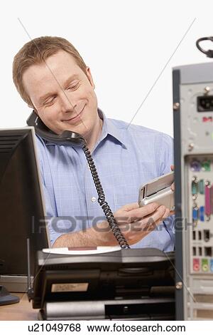 Stock Photo - Businessman talking on phone. Fotosearch