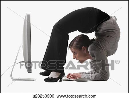 Stock Photograph - Businesswoman bending over backwards. Fotosearch