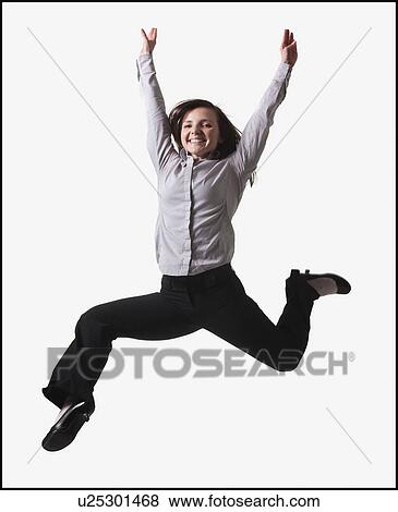 Stock Photo - Businesswoman jumping for joy. Fotosearch