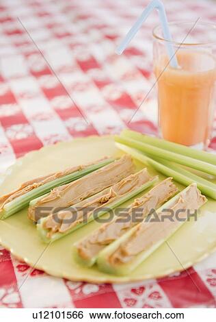Celery and peanut butter on plate View Large Photo Image Stock Photograph - Celery and peanut butter on plate. Fotosearch