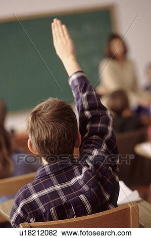 Child raising his hand in school classroom View Large Photo Image Stock Image - Child raising his hand in school classroom. Fotosearch