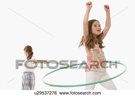 Stock Photo - Children playing with hula hoops. Fotosearch