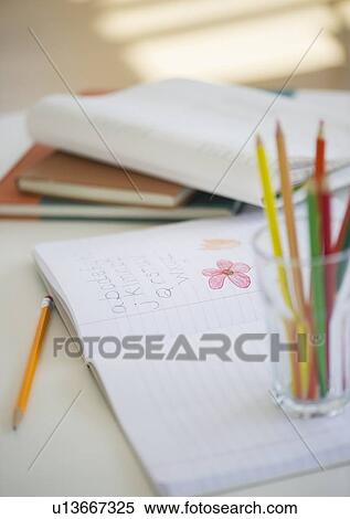 Child's notebook and colored pencils View Large Photo Image Stock Photography - Child's notebook and colored pencils. Fotosearch