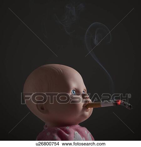 Cigarette in doll's mouth View Large Photo Image Picture - Cigarette in doll's mouth. Fotosearch