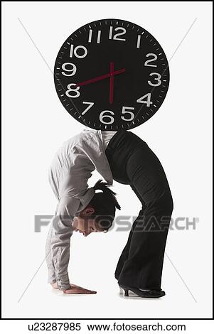 Stock Photography - Clock on top of businesswoman bending over backwards. Fotosearch