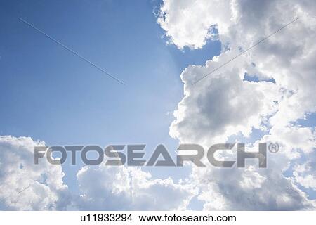 Clouds blue sky and sunlight View Large Photo Image Picture - Clouds blue sky and sunlight. Fotosearch