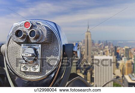 Picture - Coin operated binoculars looking out on New York City skyline. Fotosearch