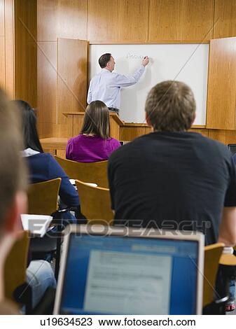 College professor giving lecture in lecture hall View Large Photo Image Stock Image - College professor giving lecture in lecture hall. Fotosearch