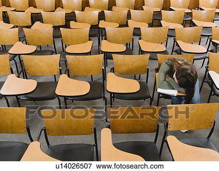 College student sleeping in empty lecture hall View Large Photo Image Stock Photo - College student sleeping in empty lecture hall. Fotosearch