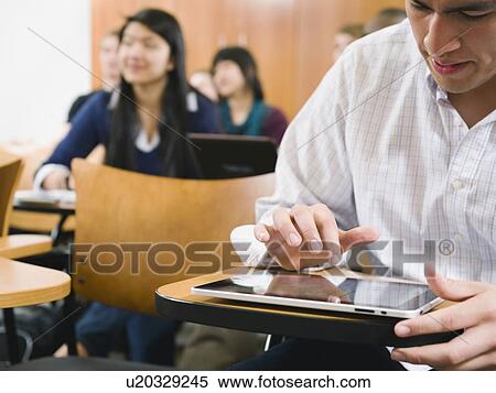 College students taking notes in lecture hall View Large Photo Image Stock Photography - College students taking notes in lecture hall. Fotosearch