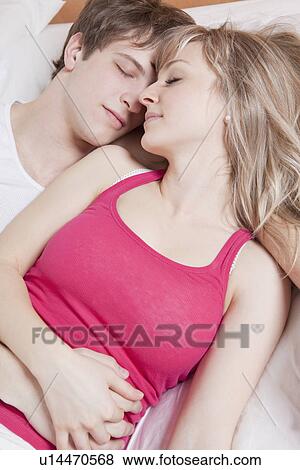 Couple sleeping together View Large Photo Image Stock Photo - Couple sleeping together. Fotosearch