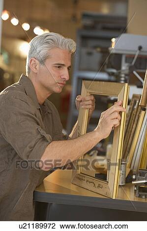 Craftsman making a picture frame View Large Photo Image Stock Image - Craftsman making a picture frame. Fotosearch