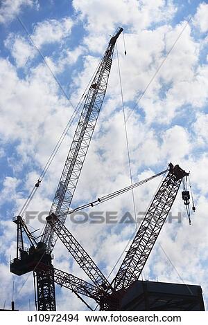 Cranes at construction site View Large Photo Image Picture - Cranes at construction site. Fotosearch