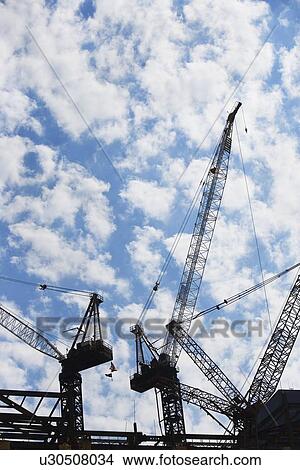 Cranes at construction site View Large Photo Image Picture - Cranes at construction site. Fotosearch