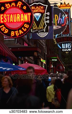 Crowd of people and Illuminated signs on Beale Street View Large Photo Image Stock Image - Crowd of people and Illuminated signs on Beale Street. Fotosearch