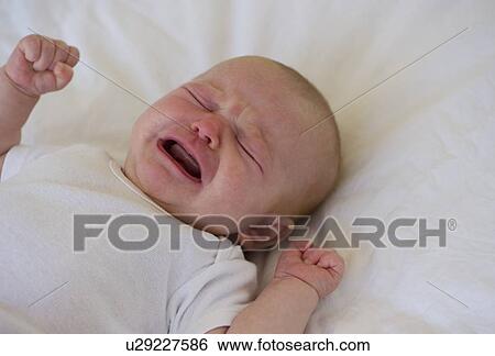 Crying infant View Large Photo Image Stock Photograph - Crying infant. Fotosearch