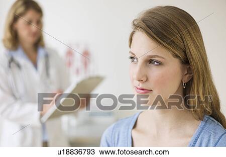 Doctor and patient exam room View Large Photo Image Stock Image - Doctor and patient exam room. Fotosearch