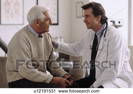 Doctor consulting with patient View Large Photo Image Stock Image - Doctor consulting with patient. Fotosearch