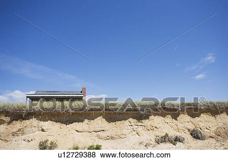 Dunes and roof in the background View Large Photo Image Stock Photo - Dunes and roof in the background. Fotosearch