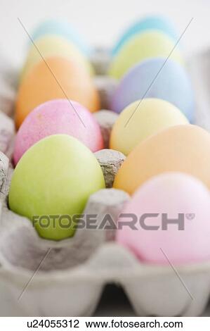 Stock Image - Dyed Easter eggs in carton. Fotosearch