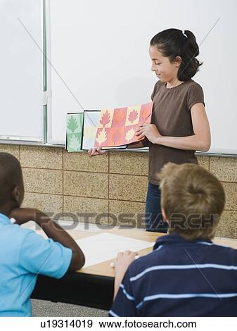 Stock Photo - Elementary student giving class presentation. Fotosearch