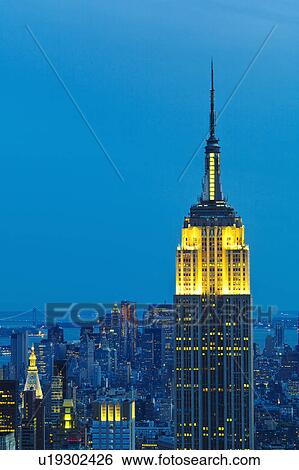 Stock Photograph - Empire State building at sunset. Fotosearch