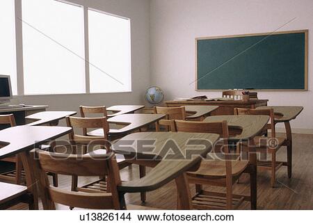 Picture - Empty desk in elementary school classroom. Fotosearch