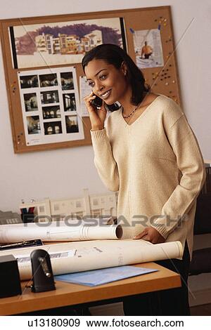 Female architect talking on the phone View Large Photo Image Stock Photo - Female architect talking on the phone. Fotosearch