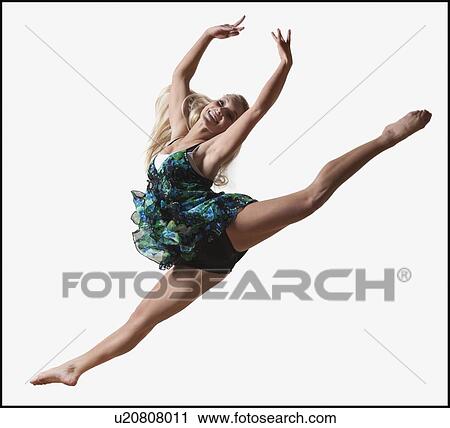 Female dancer jumping gracefully in the air View Large Photo Image Stock Image - Female dancer jumping gracefully in the air. Fotosearch