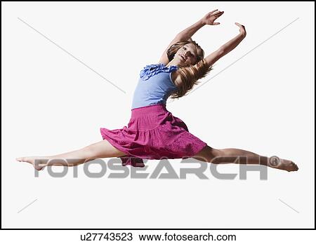 Female dancer jumping gracefully in the air View Large Photo Image Stock Image - Female dancer jumping gracefully in the air. Fotosearch