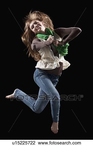 Stock Image - Female dancer performing lyrical dance. Fotosearch