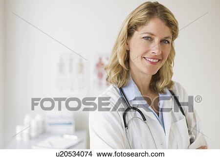 Female doctor in her office View Large Photo Image Picture - Female doctor in her office. Fotosearch