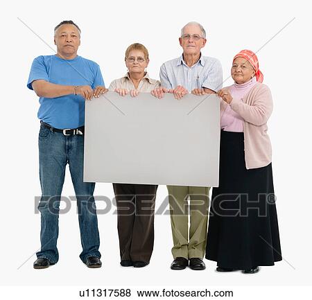 Stock Photo - Four people holding a blank poster. Fotosearch