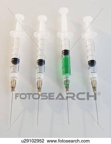 Stock Image - Four syringes. Fotosearch