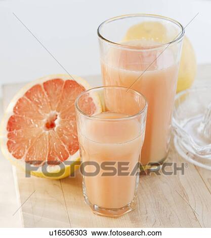 Freshly squeezed grapefruit juice View Large Photo Image Stock Image - Freshly squeezed grapefruit juice. Fotosearch