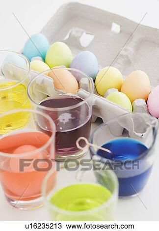 Glasses of dye and colored eggs View Large Photo Image Stock Image - Glasses of dye and colored eggs. Fotosearch