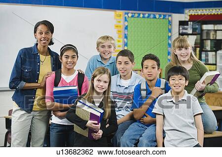 Group of elementary school students in classroom View Large Photo Image Stock Image - Group of elementary school students in classroom. Fotosearch